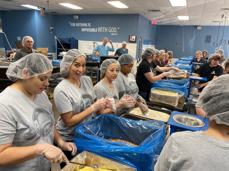 The Addison Dentist team volunteers with Feed My Starving Children, where we pack hundreds of meals that are developed by food science and nutrition professionals to supplement nutritional needs and reduce problems with malnutrition.